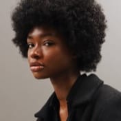 a beautiful girl with a afro.